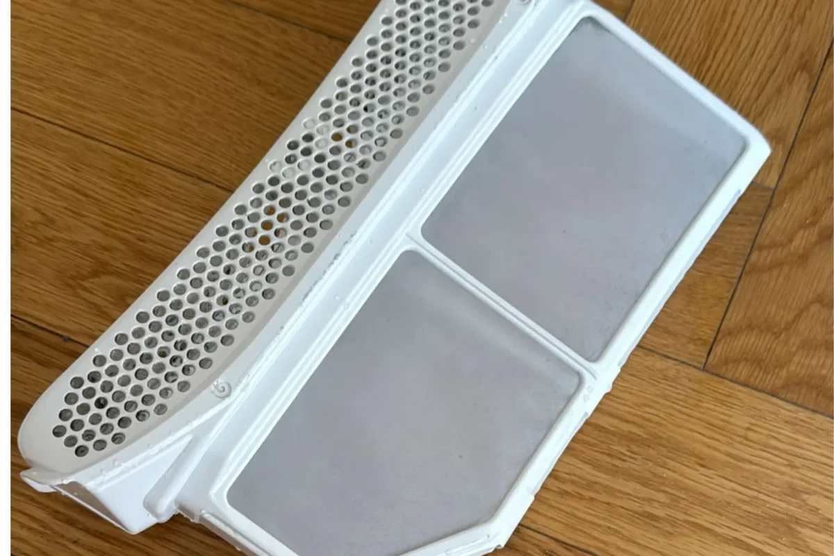 Dryer lint filter completely cleared and clean after Airbnb cleaning service in NYC