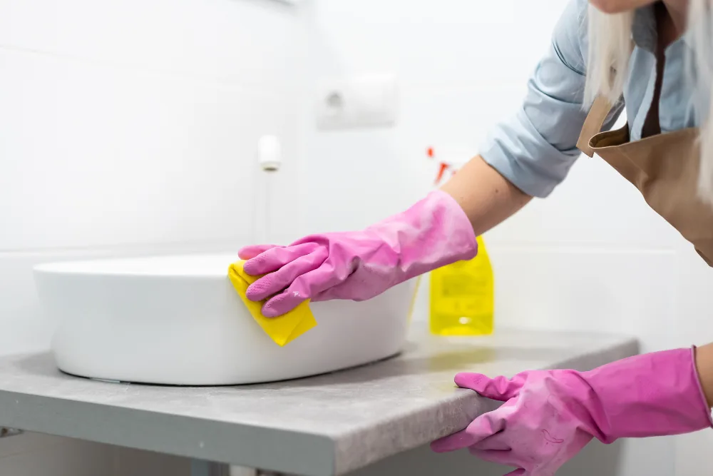 Cleaning Chief professional performing bathroom reset in NYC