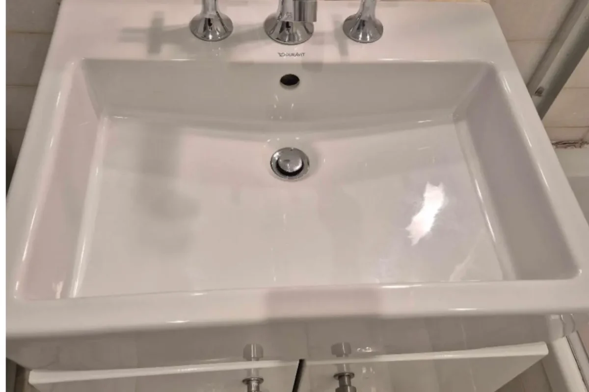 Spotless bathroom sink with polished fixtures after a Cleaning Chief deep clean in a New York City apartment.