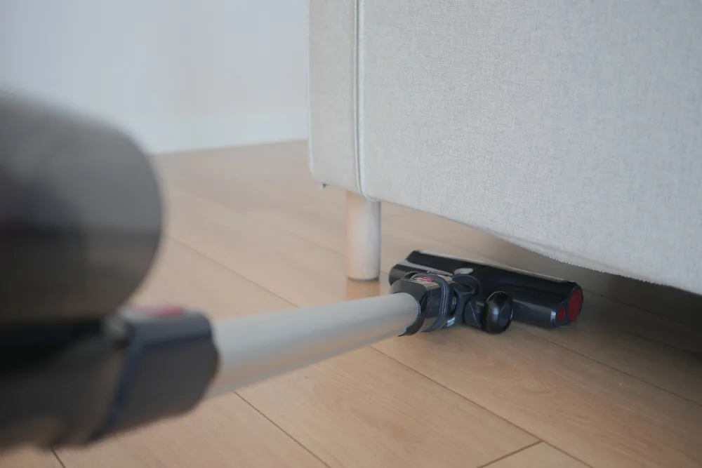 Cleaning Chief professional performing behind & under furniture in NYC