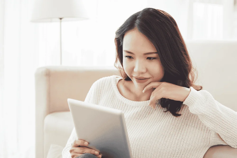 Customer relaxing at home while booking a professional cleaning service online through Cleaning Chief's mobile-friendly portal