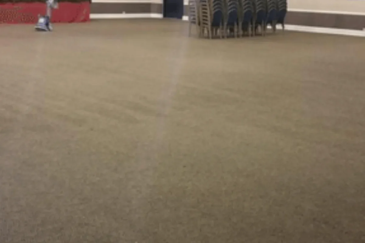 Same event hall carpet fully restored to uniform color with all stains removed after commercial carpet cleaning in NYC