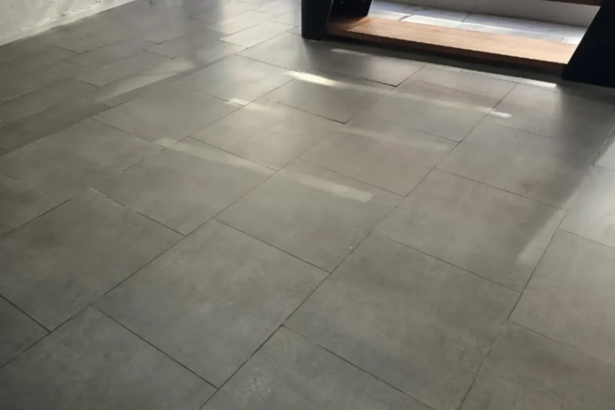 Clean large-format gray tile floor in commercial space after commercial deep cleaning service in NYC