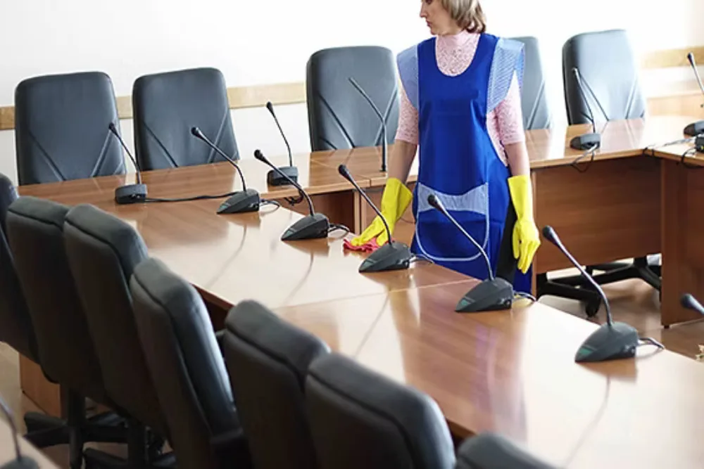 Cleaning Chief professional performing conference room reset in NYC