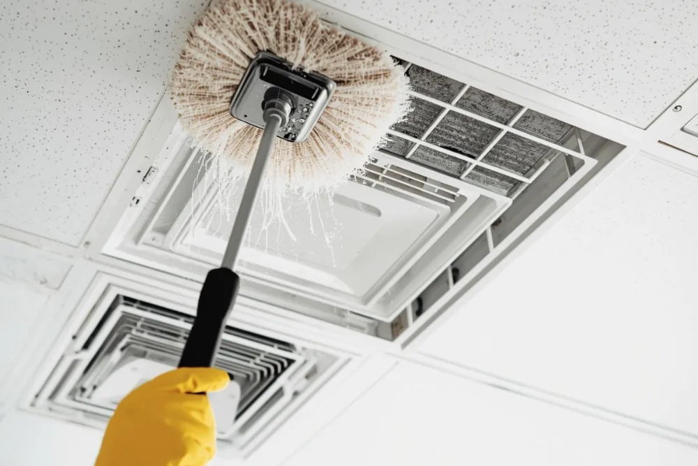Cleaning Chief professional performing construction dust removal in NYC