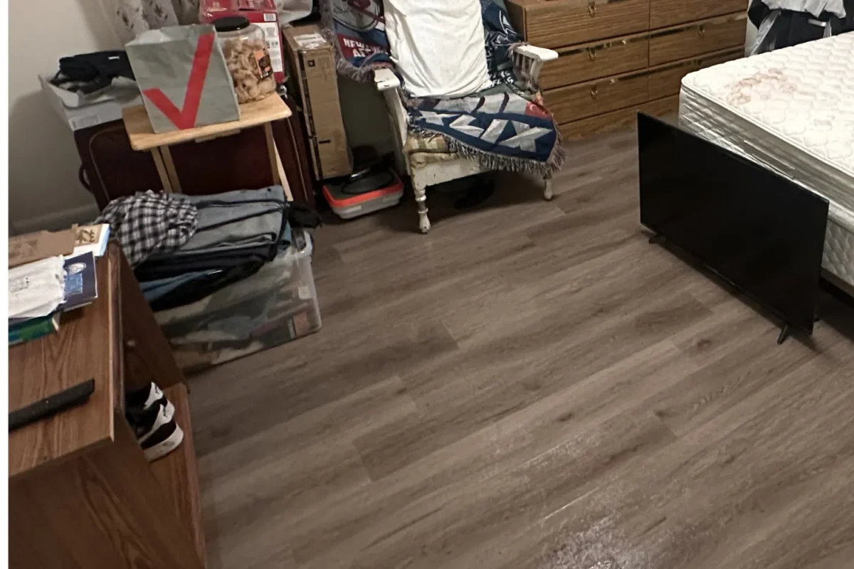 Clear and clean bedroom floor with hardwood swept and furniture organized after deep cleaning in NYC