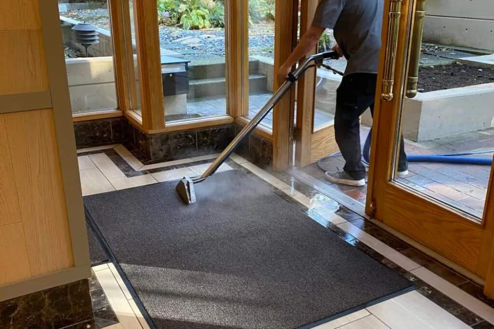 Cleaning Chief professional performing entry mat and walk-off cleaning in NYC