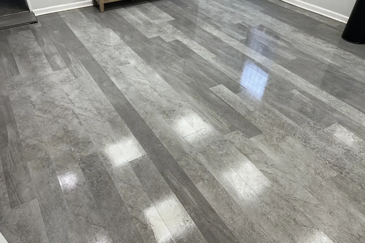 Same stone tile floor with high-gloss mirror finish after Cleaning Chief floor buffing service in NYC