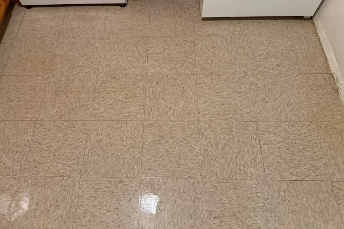 Kitchen vinyl tile floor restored clean and shiny after professional floor buffing service in NYC