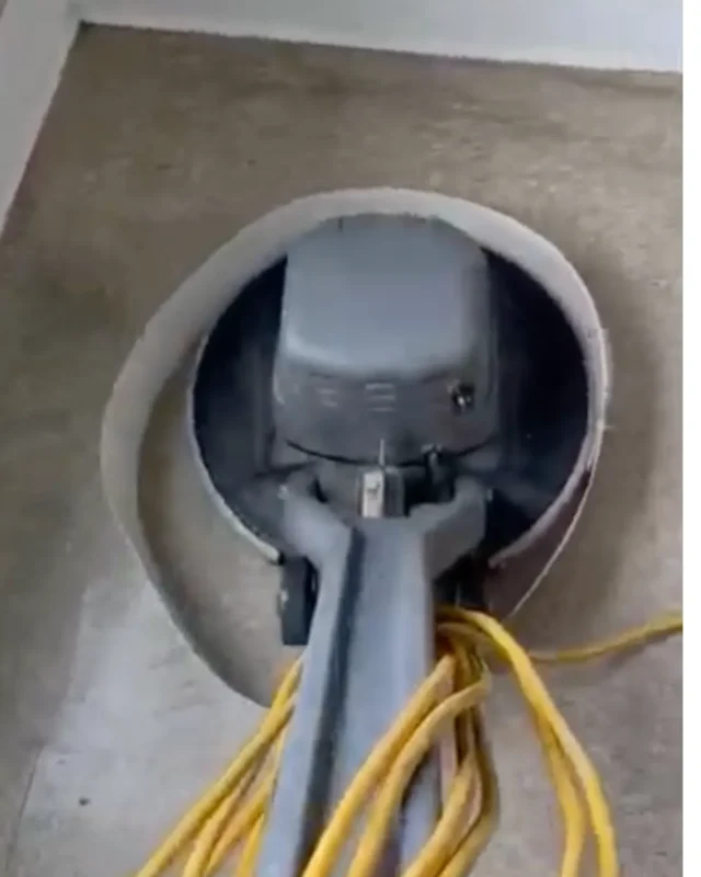 Close-up of professional floor buffing machine pad in contact with floor surface during service in NYC