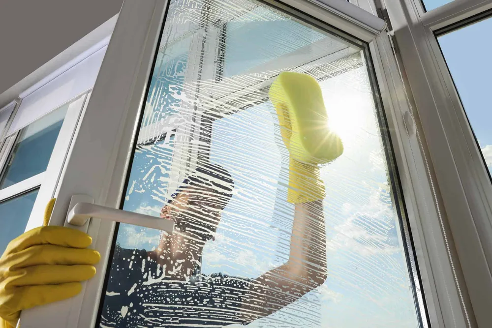 Cleaning Chief professional performing glass door and entry cleaning in NYC