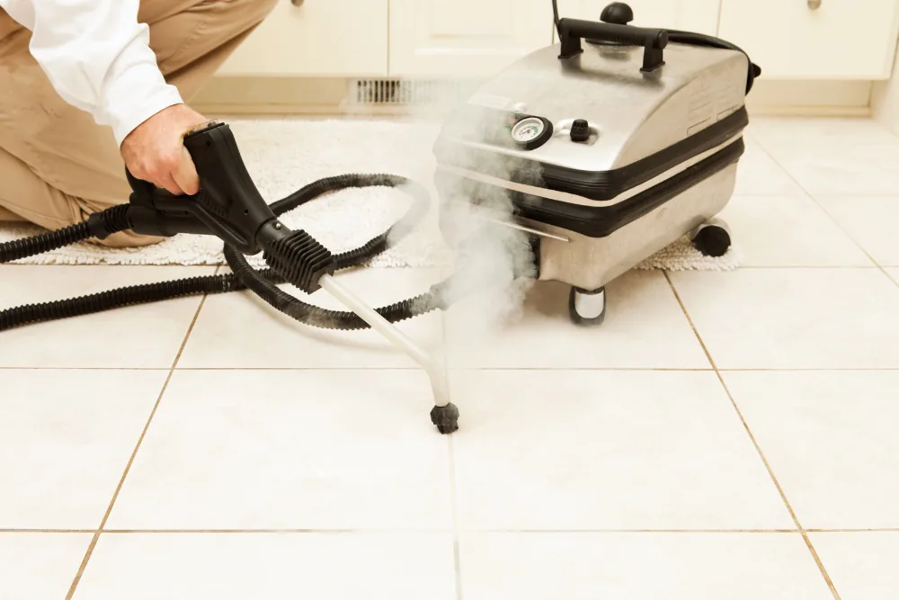 Cleaning Chief professional performing grout color restoration in NYC