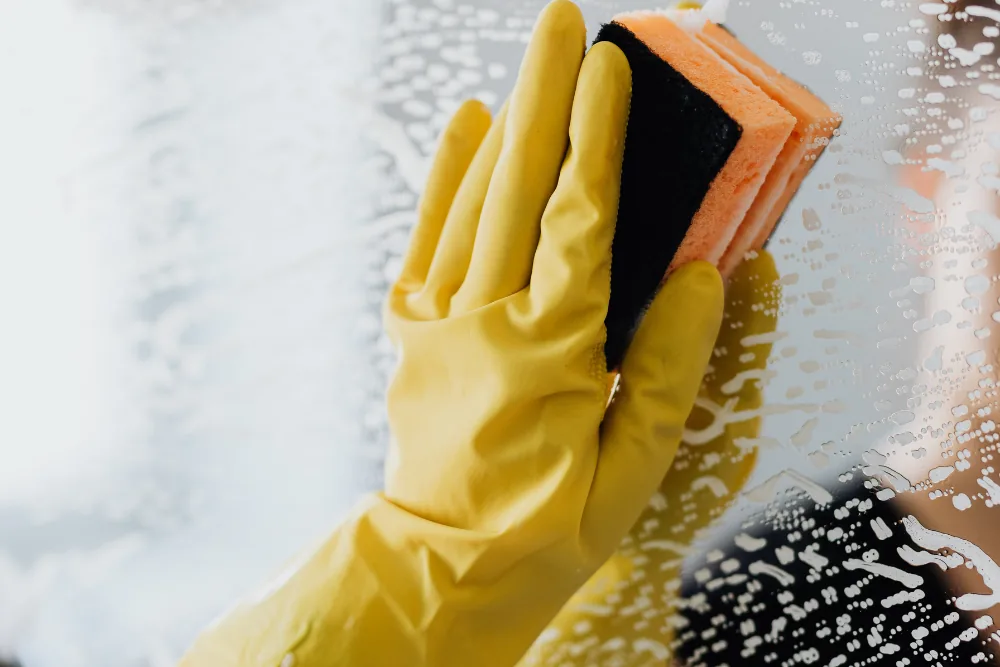 Cleaning Chief professional performing interior window cleaning in NYC