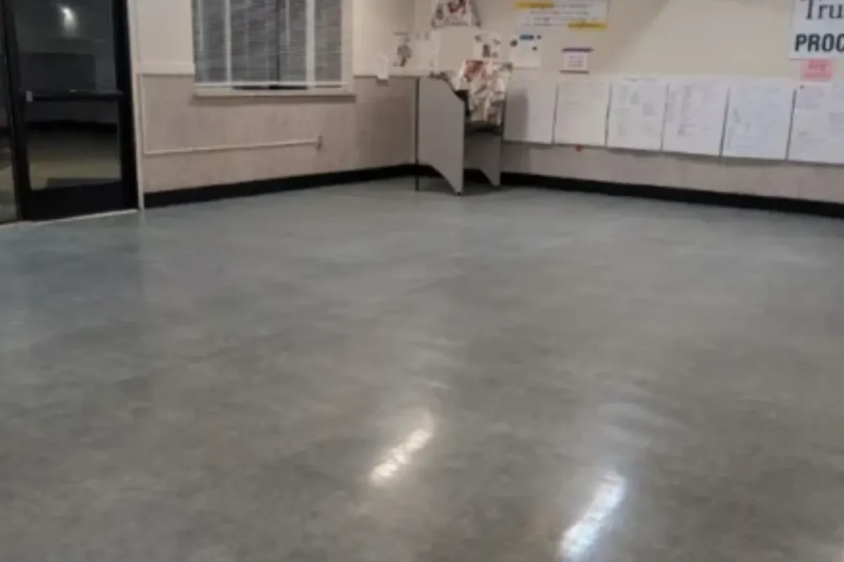 Large commercial space with dirty concrete floor before Cleaning Chief janitorial service in NYC