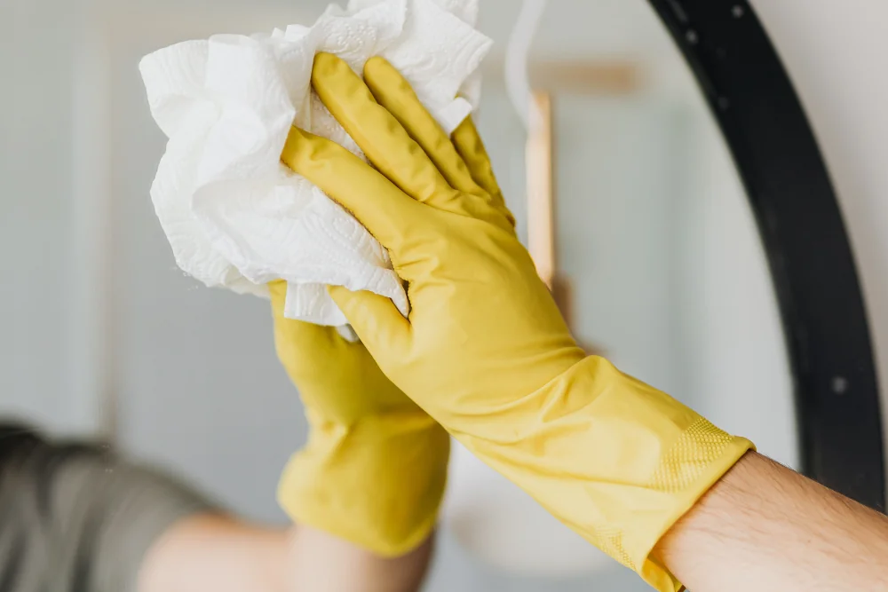 Cleaning Chief professional performing mirrors & glass spot cleaning in NYC