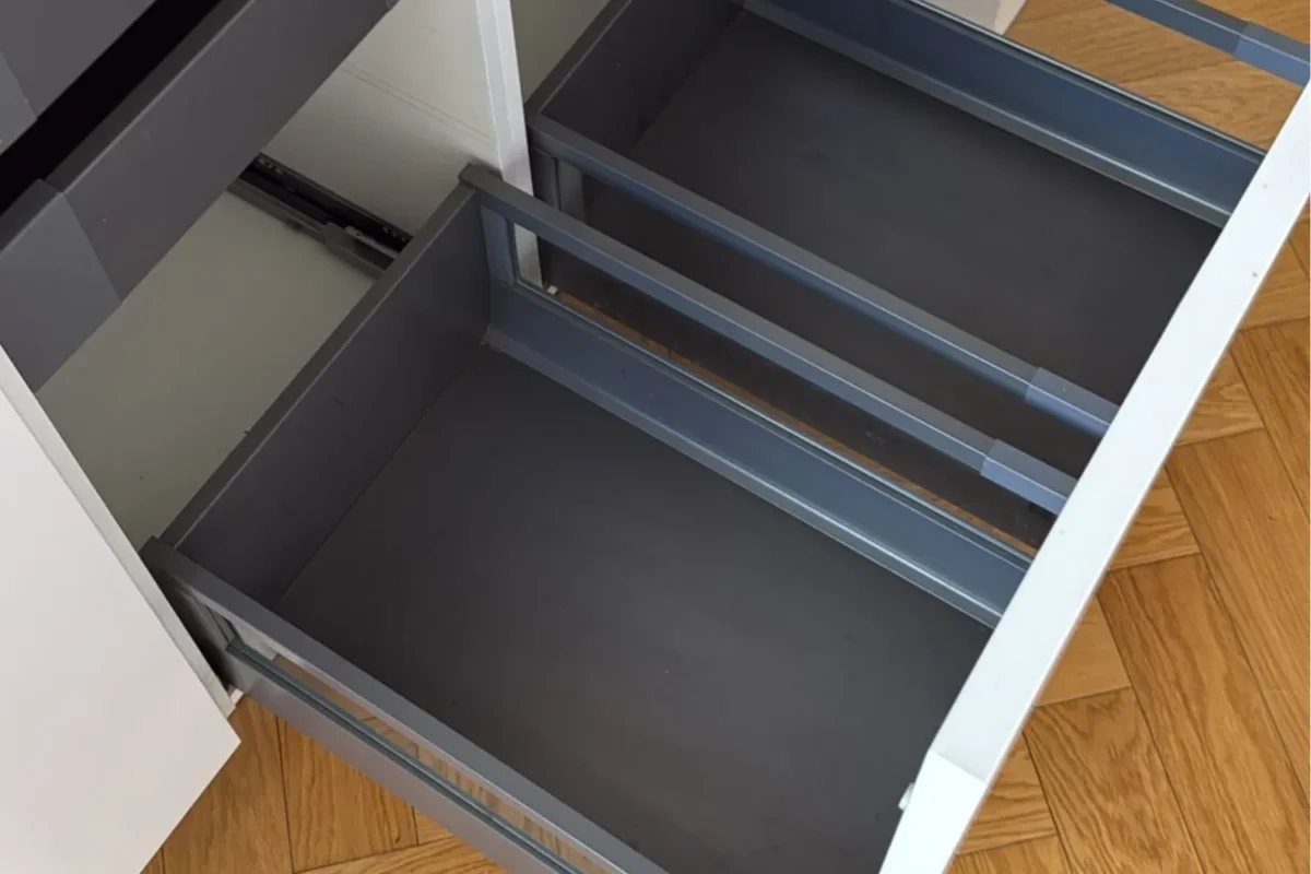 Clean kitchen drawer with organizer inserts and no debris after post-construction cleaning in NYC