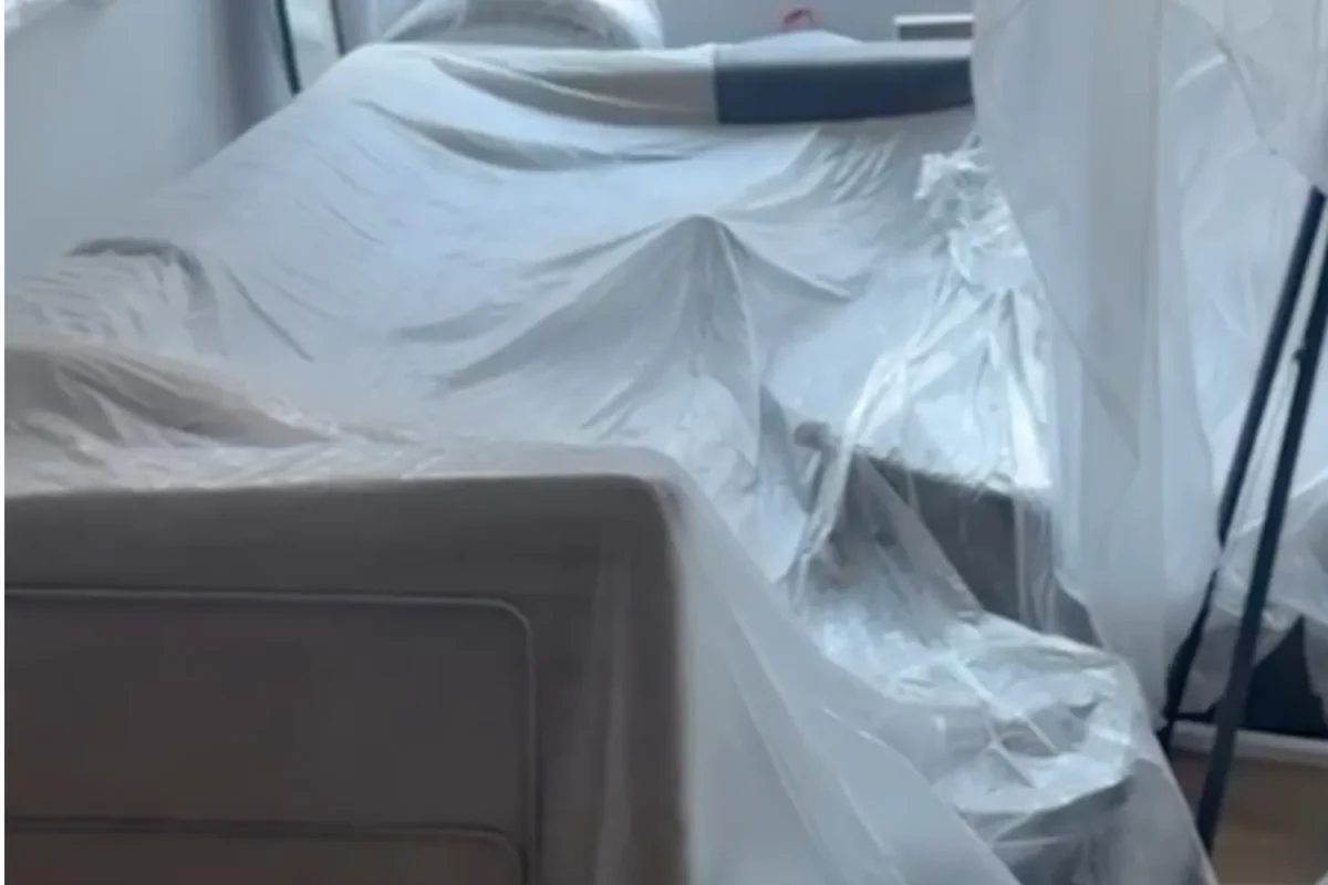 Furniture wrapped in plastic protective sheeting during NYC apartment renovation or construction