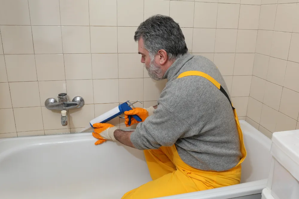 Cleaning Chief professional performing re-caulking in NYC