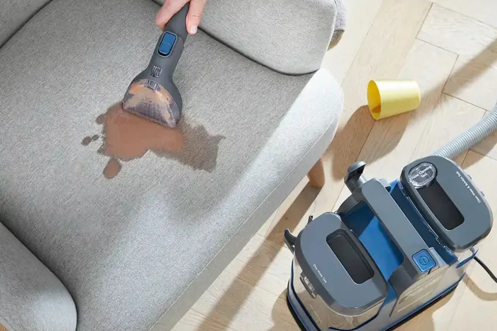 Cleaning Chief professional performing stain and spot treatment in NYC