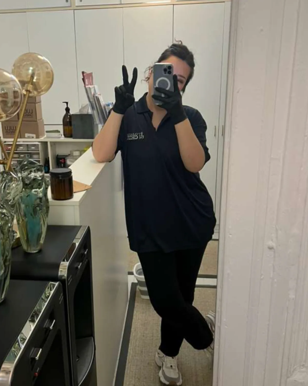 Cleaning Chief cleaner dusting window blinds in NYC apartment during standard cleaning