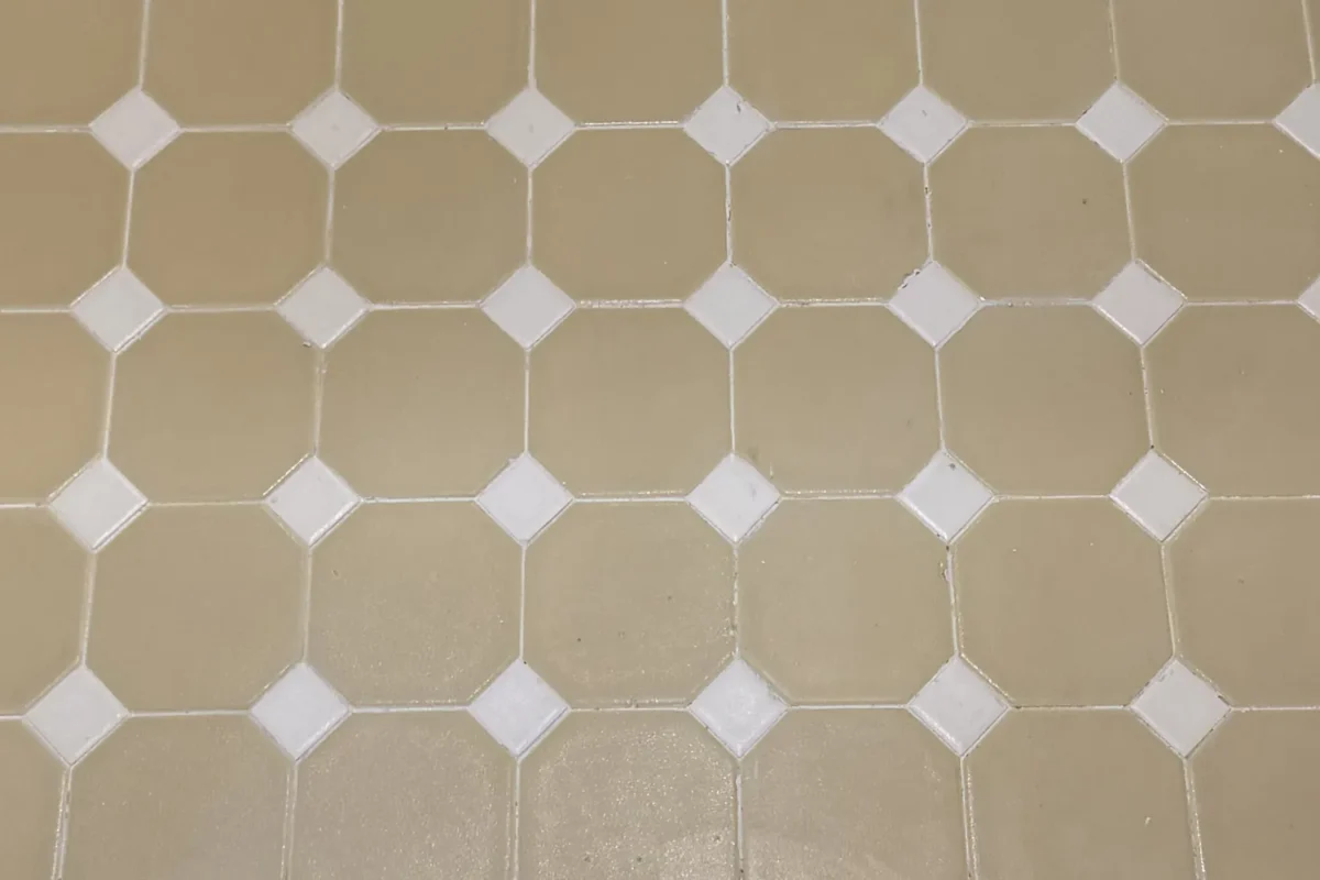 Classic octagonal tile floor with bright white grout lines and clean tile surface fully restored in NYC