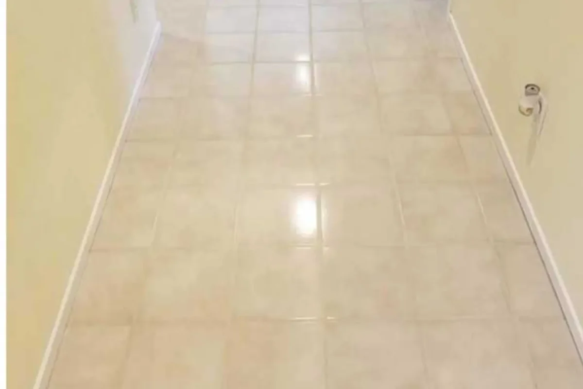 Commercial hallway tile floor with bright white clean grout lines after power washing in NYC