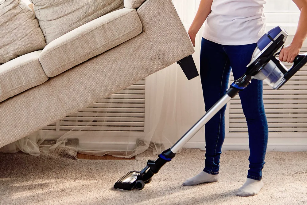 Cleaning Chief professional performing under furniture and fixture cleaning in NYC