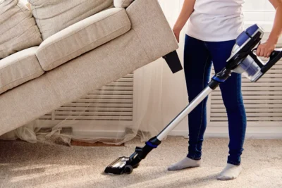 Cleaning Chief professional performing under furniture and fixture cleaning in NYC