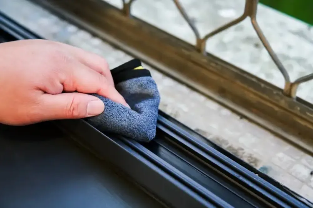 Cleaning Chief professional performing window track and frame cleaning in NYC